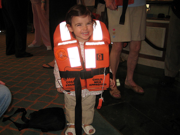whitearrow > Zoe at the muster drill.  Cutest life-jacket model ever.